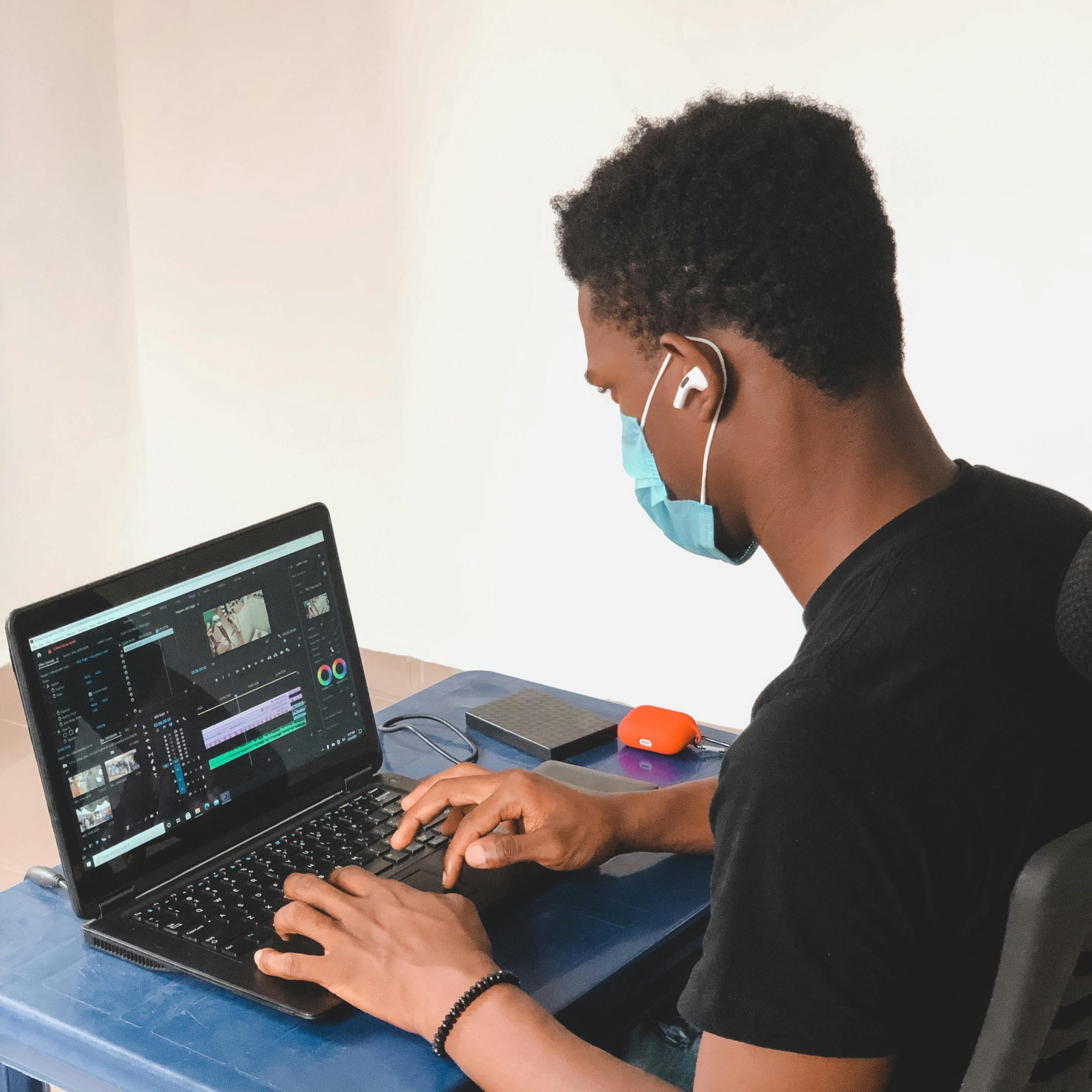 "Young boy using a laptop to access the internet, focused on the screen."