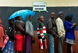 "Kenyan citizens standing in a long queue, patiently waiting to cast their votes during the general elections, showcasing the democratic process in action